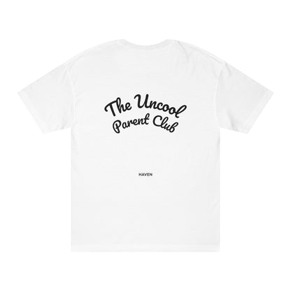 White t-shirt with 'The Uncool Parent Club' text on a white background
