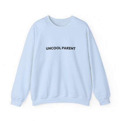 Light blue sweatshirt with 'UNCOOL PARENT' text on a white background