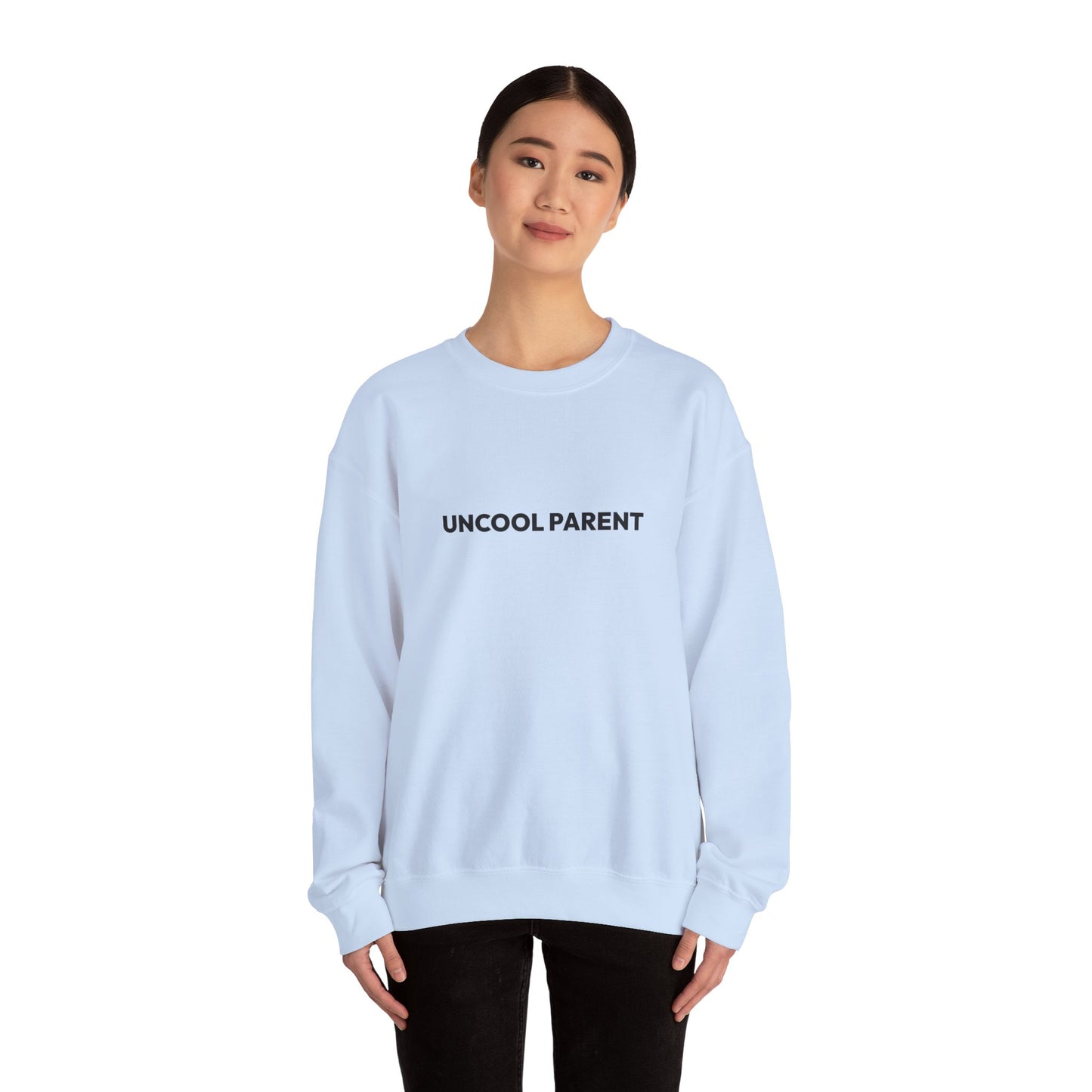 Person wearing a light pink sweatshirt on a white background