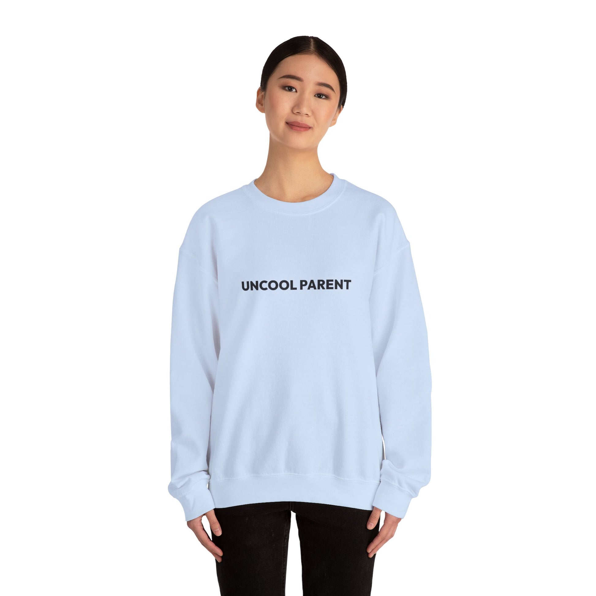 Person wearing a light pink sweatshirt on a white background
