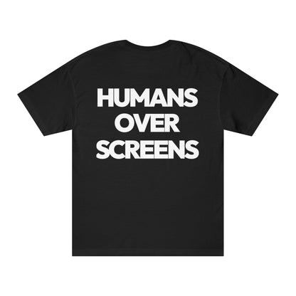 Black t-shirt with 'HUMANS OVER SCREENS' text on a white background